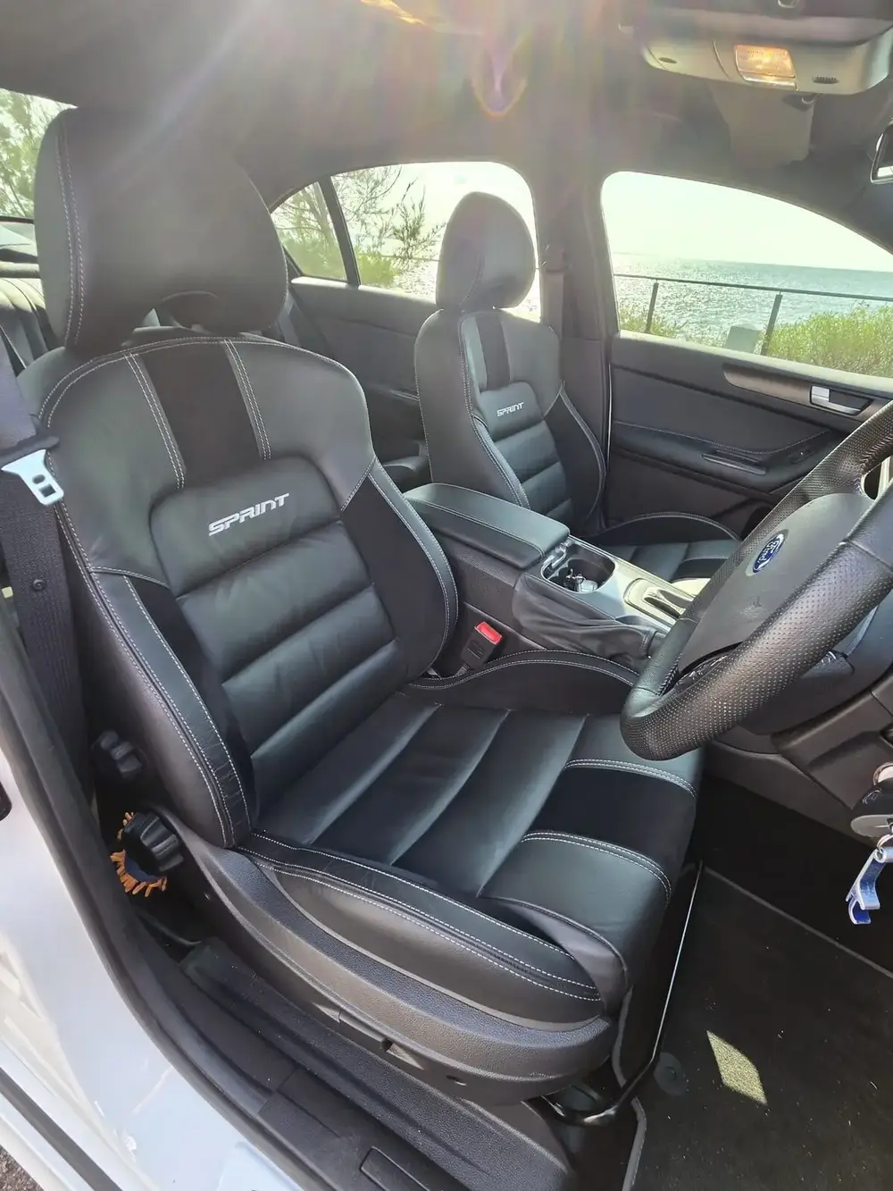 Clean dark leather interior of the sedan