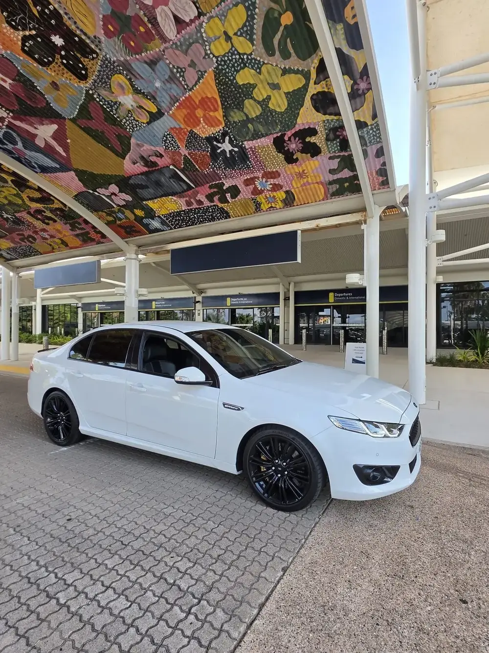 White performance sedan of the Steed & Co. fleet